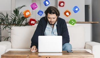A man checking google trends on his laptop